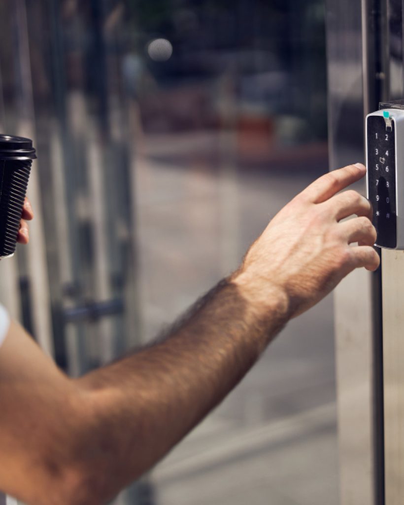 cut-picture-hand-man-turning-intercom-with-smartphone-outdoor-close-up cut-picture-hand-man-turning-intercom-with-smartphone-outdoor-close-up