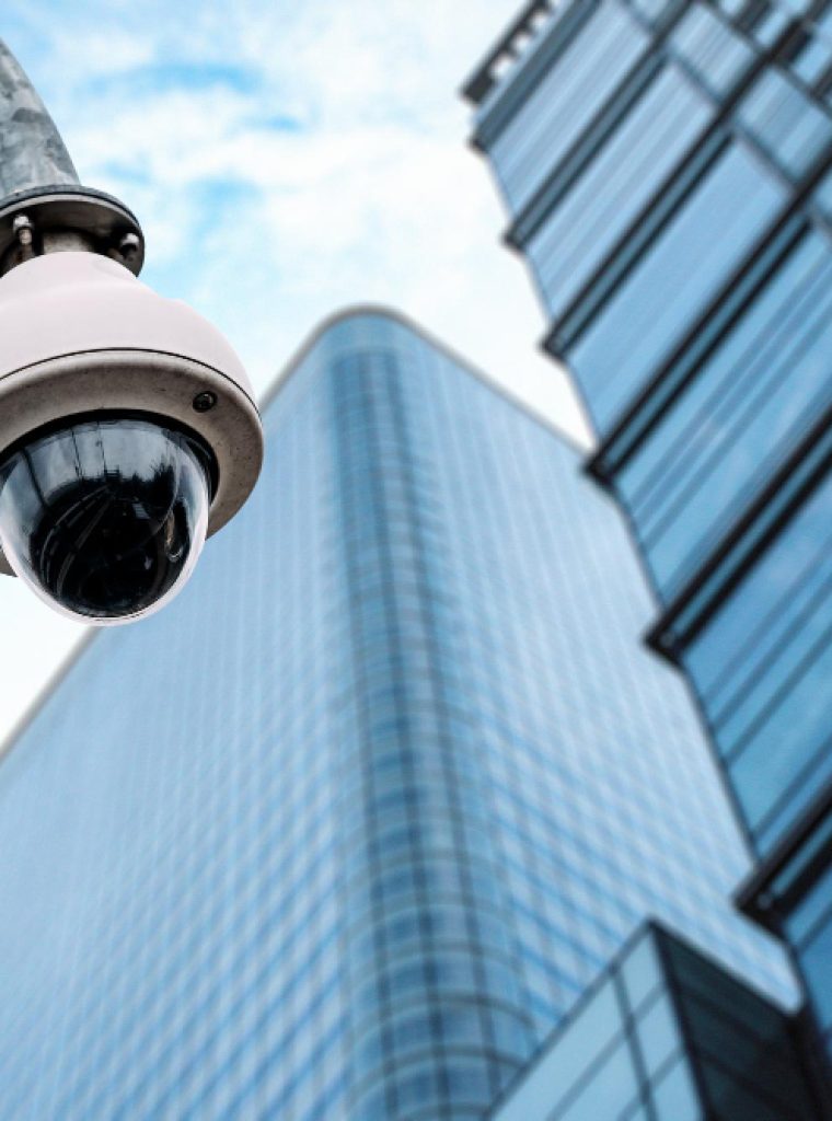 security-camera-with-glass-building-background security-camera-with-glass-building-background